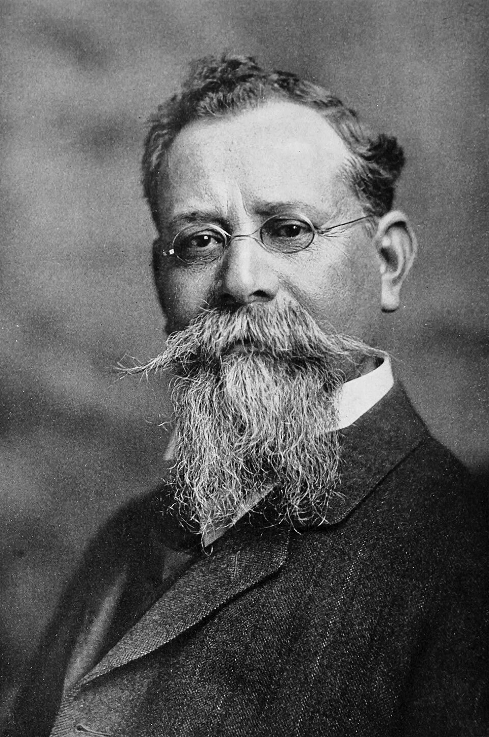 Studio portrait of Venustiano Carranza with a long white beard and round glasses